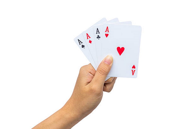 Playing cards in hand isolated on white background-Hand Rankings in Texas Hold’em